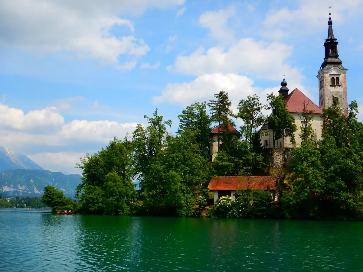 Church tower rising above the trees of Bled Island
