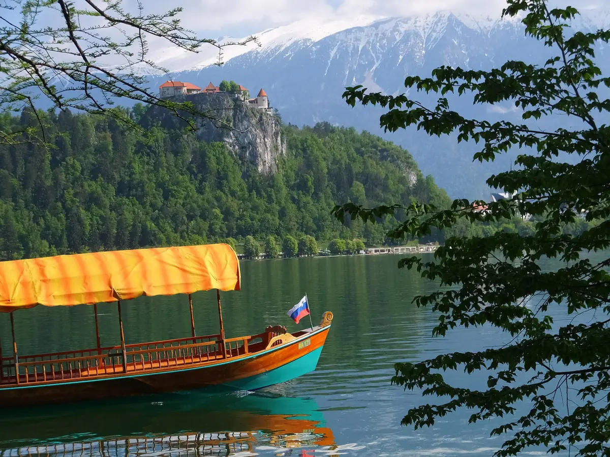 A pletna with Bled Castle in the background