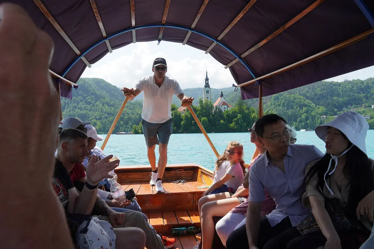 Passengers on a pletna on the way to the island